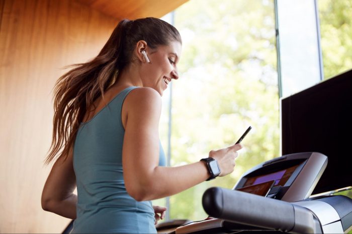 Woman smiling on the treadmill