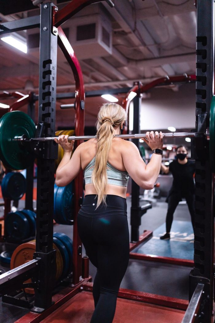 Woman on a smith machine
