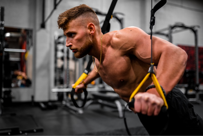 Man working out with TRX cables