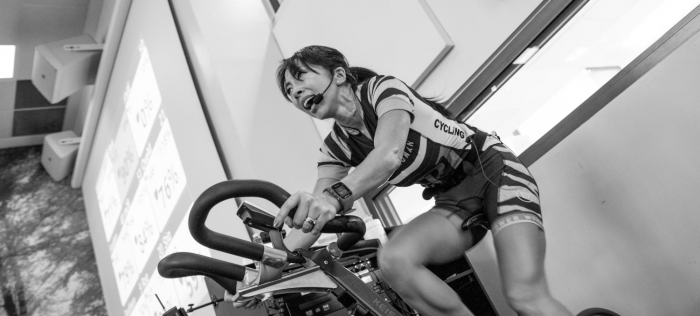 Woman riding a bike with intensity
