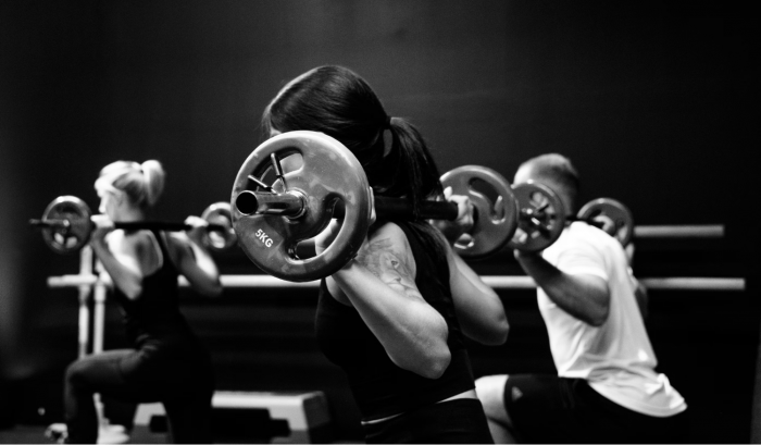 Woman working out with barbell