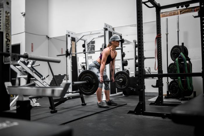 Woman deadlifting in the gym