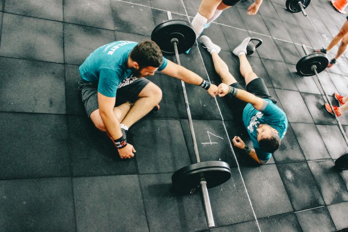 Men fistbumping in the gym