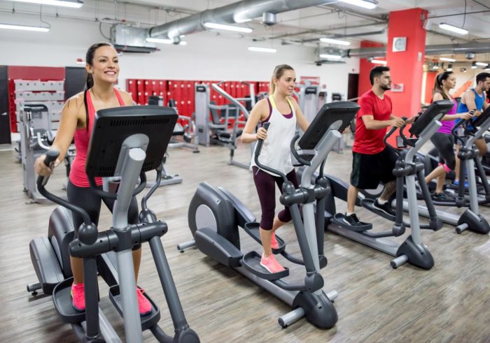 Group of people on cross trainers