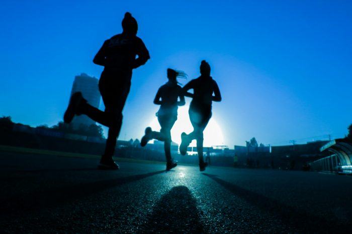 Three runners in a group