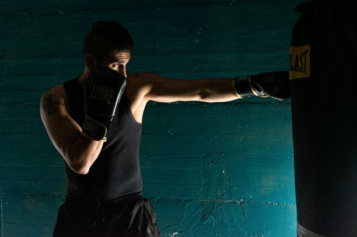 Man punching a punch bag