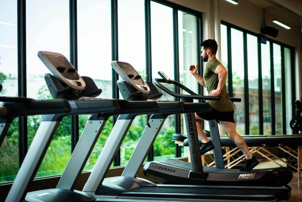 A gym with high ceilings and natural light