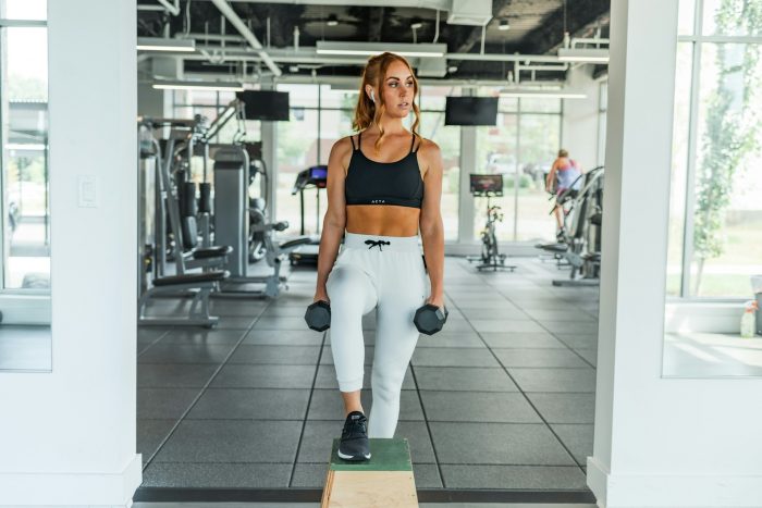 Woman stepping in gym