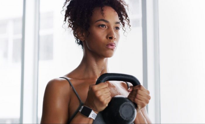 Woman holding a kettlebell