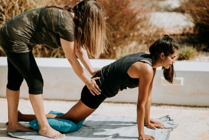 Two women stretching