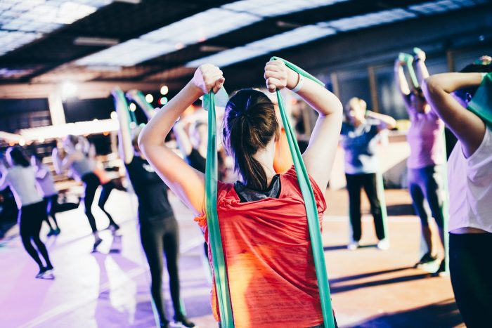 Fitness class with people using resistance bands
