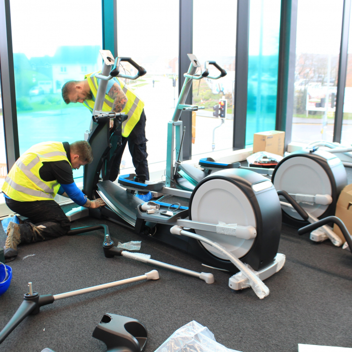 Men installing gym equipment