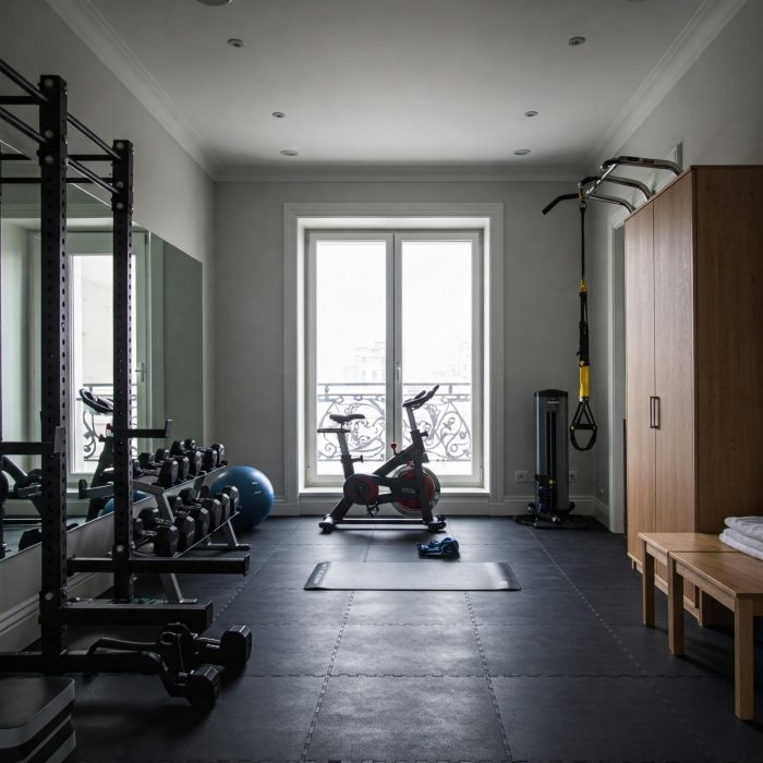 Exercise bike in front of a home gym window