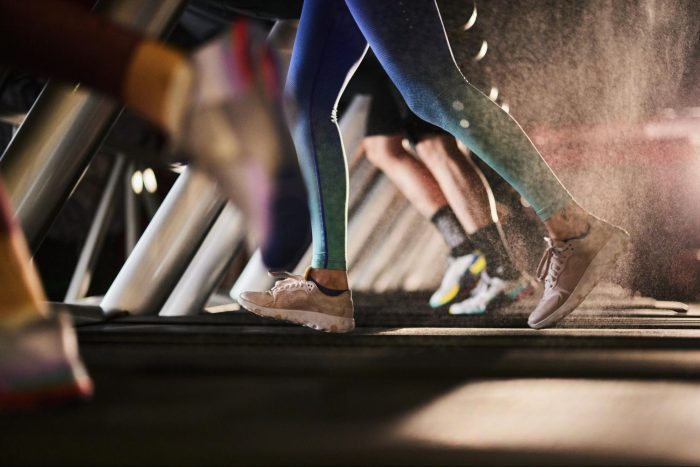 Person running in the gym on a treadmill