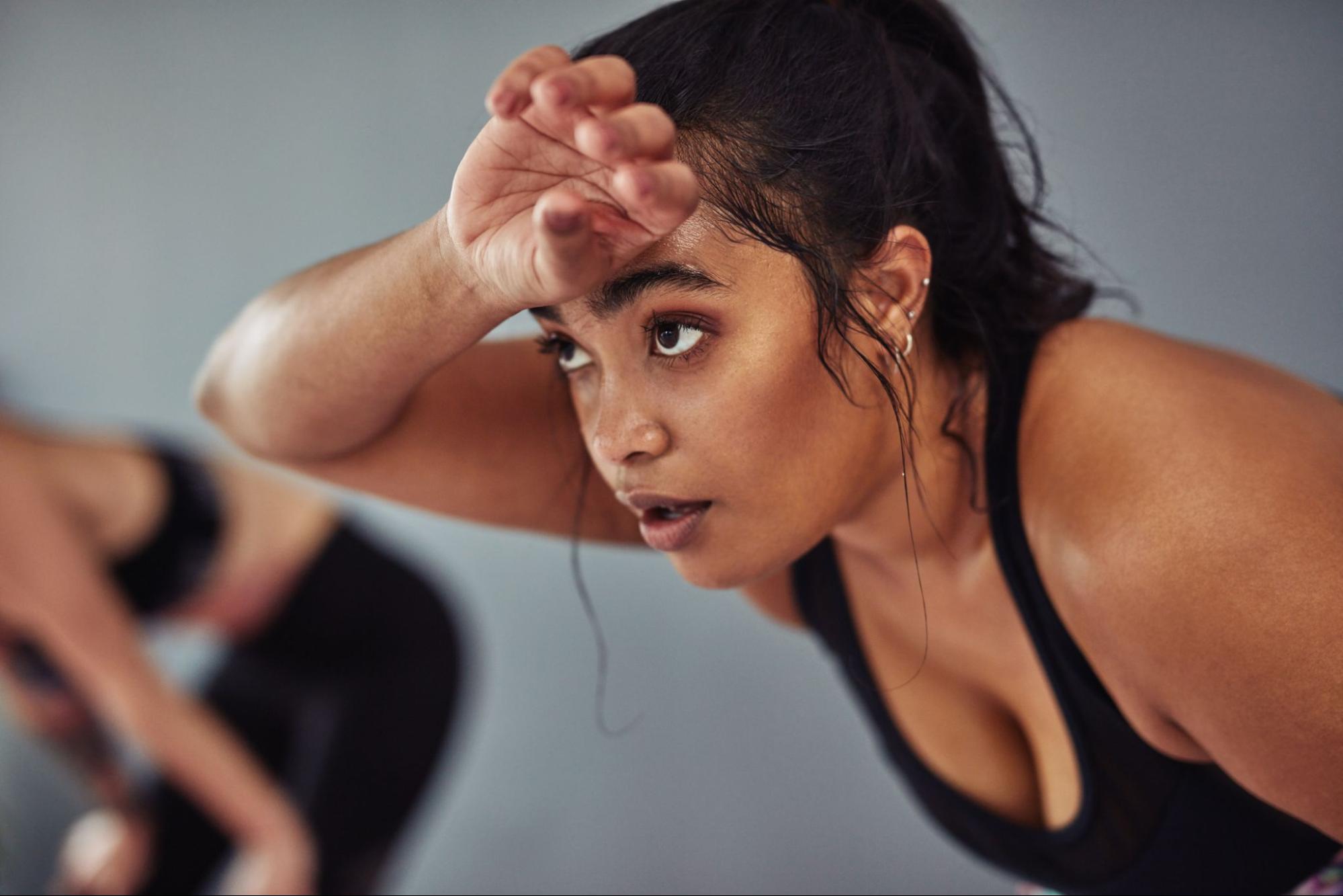 Woman sweating in a gym class