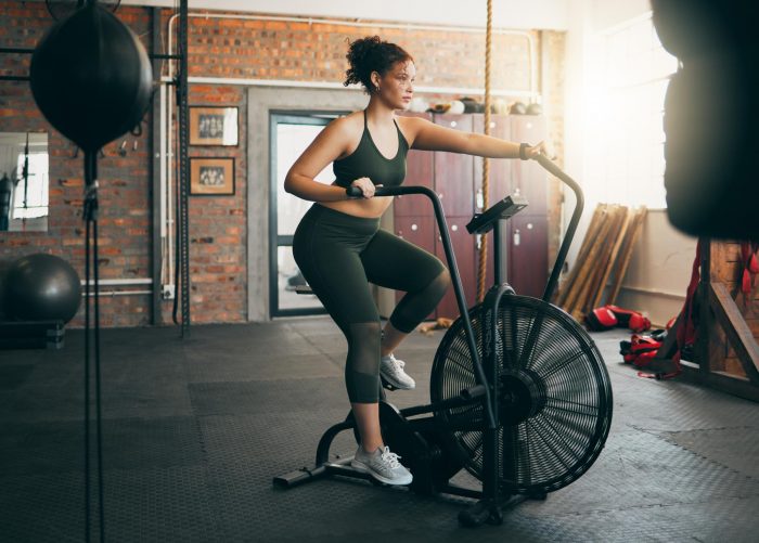 Woman on an air bike in a gym
