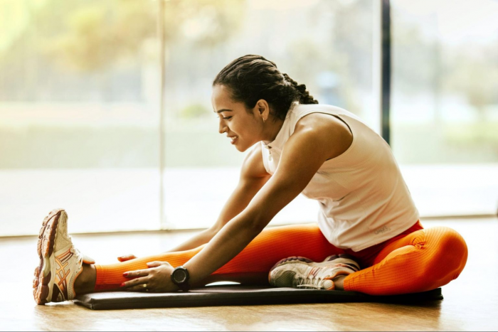 Woman stretching on a yoga mat