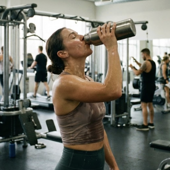 A woman drinking a protein shake