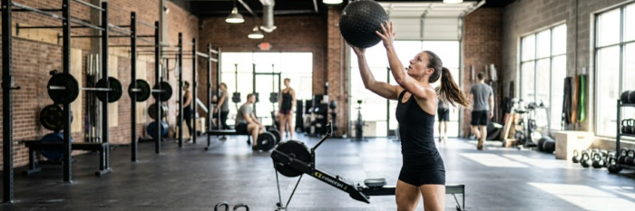 Woman throwing a slam ball